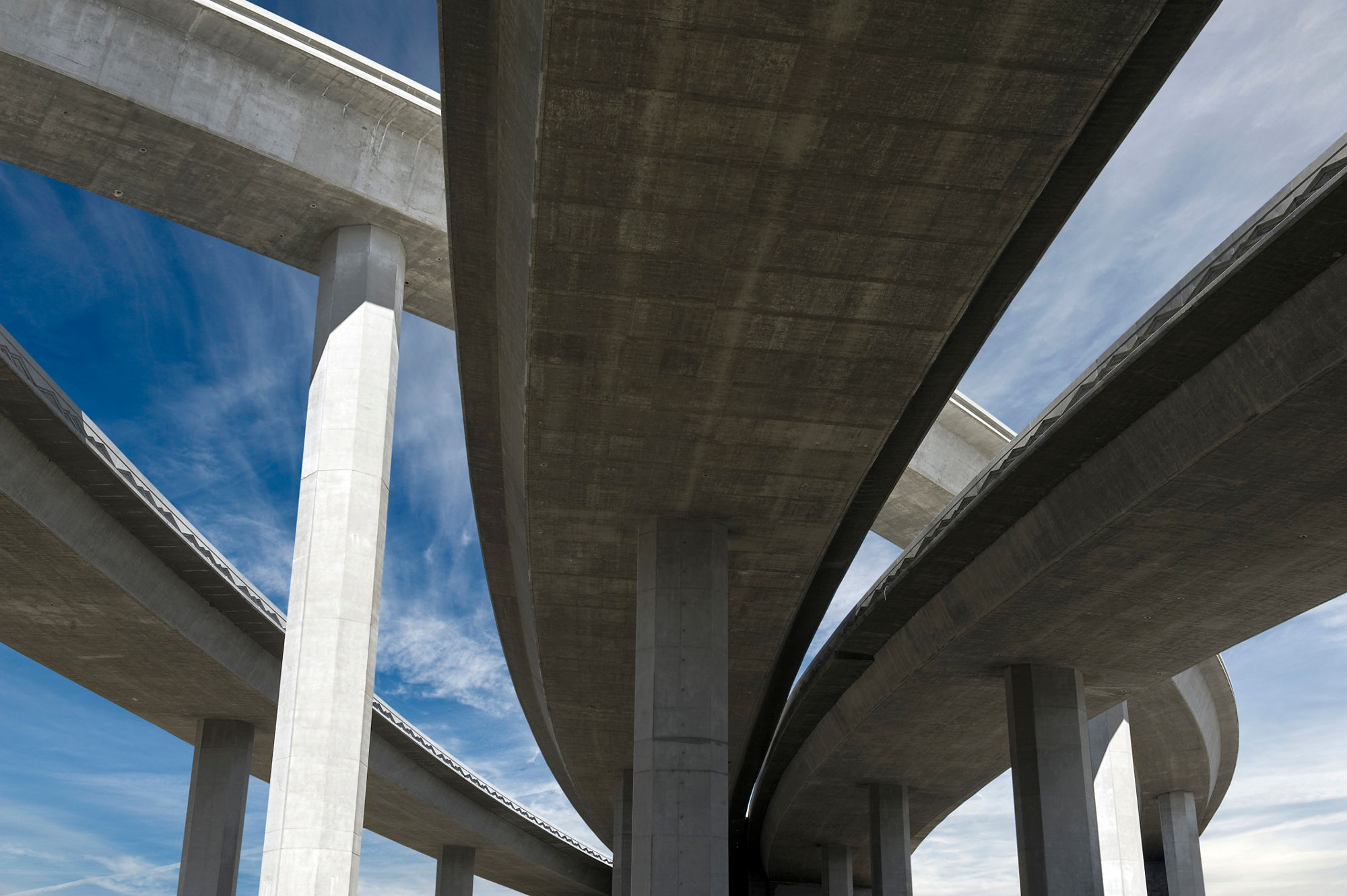 Elevated roadway with bright blue sky