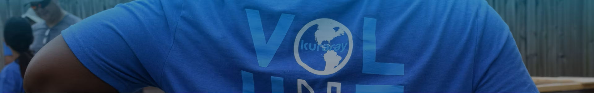 Kuraray volunteer wearing a blue volunteer shirt at a community service event | Kuraray Foundation of America, Inc. 