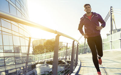Men running in the morning with sunlight on background