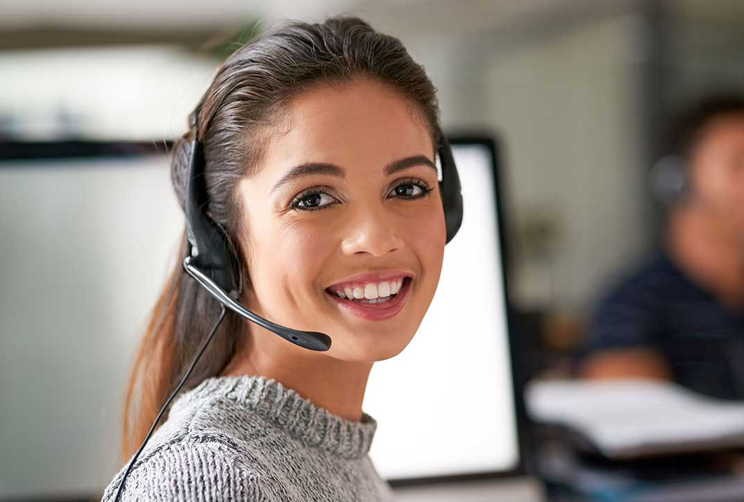 Friendly employee with a headset