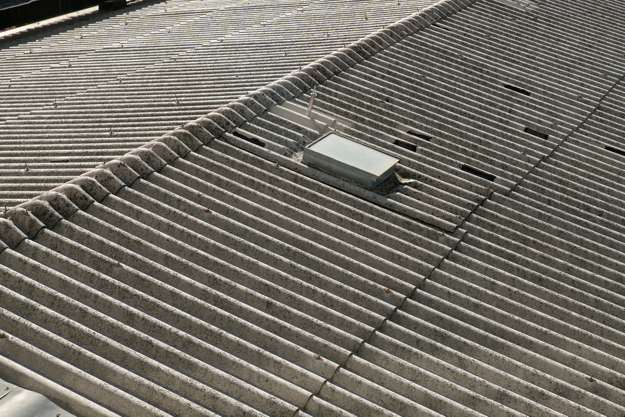 Cement corrugated roof, similar to asbestos with asbestos inside. the verification of materials is important for any works.