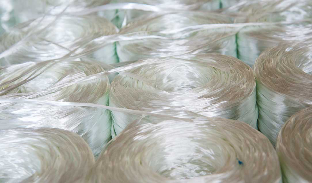 Rolls of industrial specialty fibers