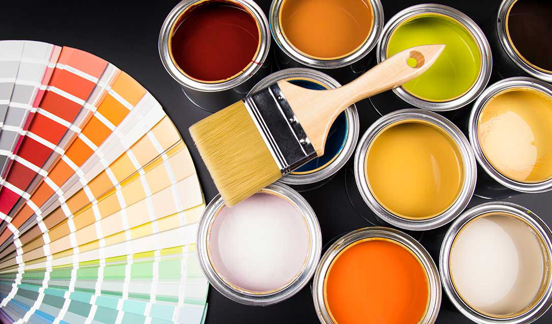  shade card, various cans of paint and a paintbrush.