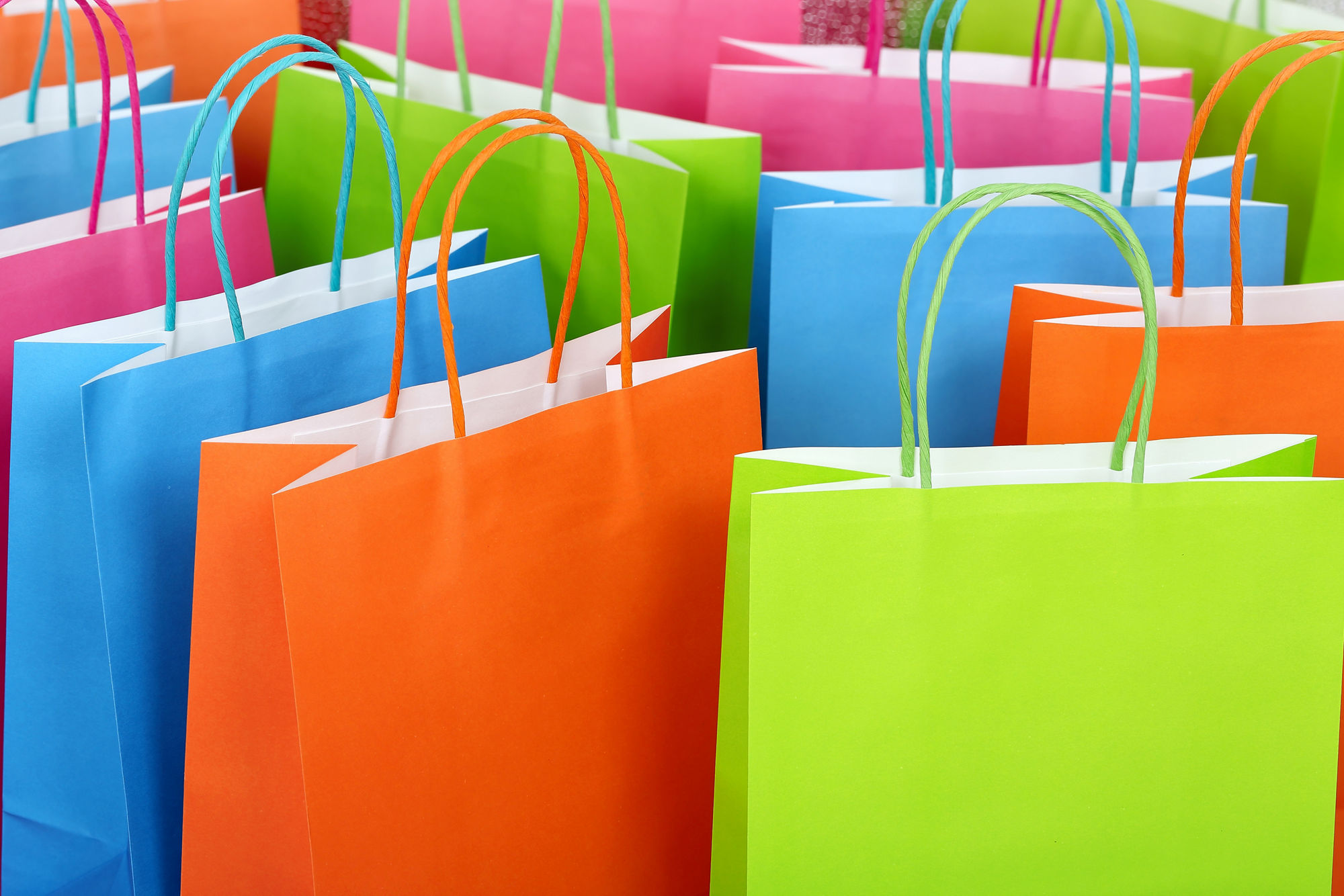 close up of colorful paper shopping bags