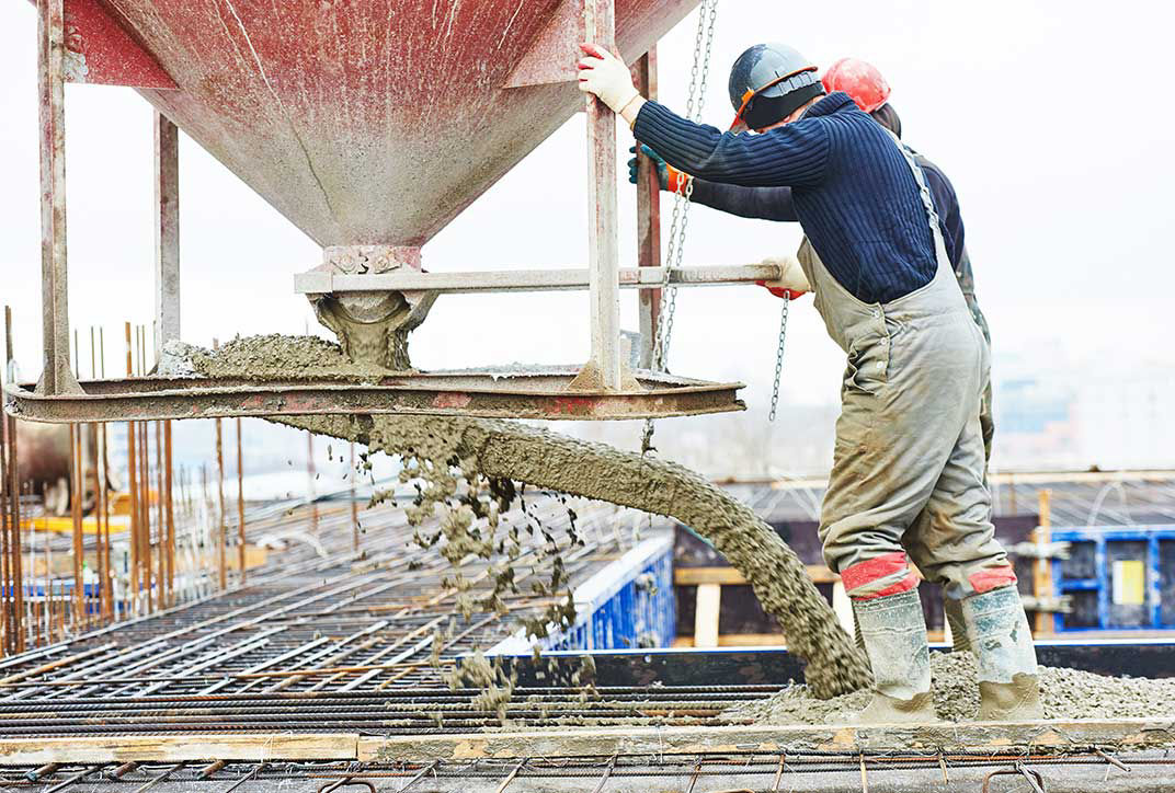 construction workers working with cement 