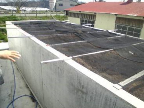 Image of  odor reduction container of compost barn