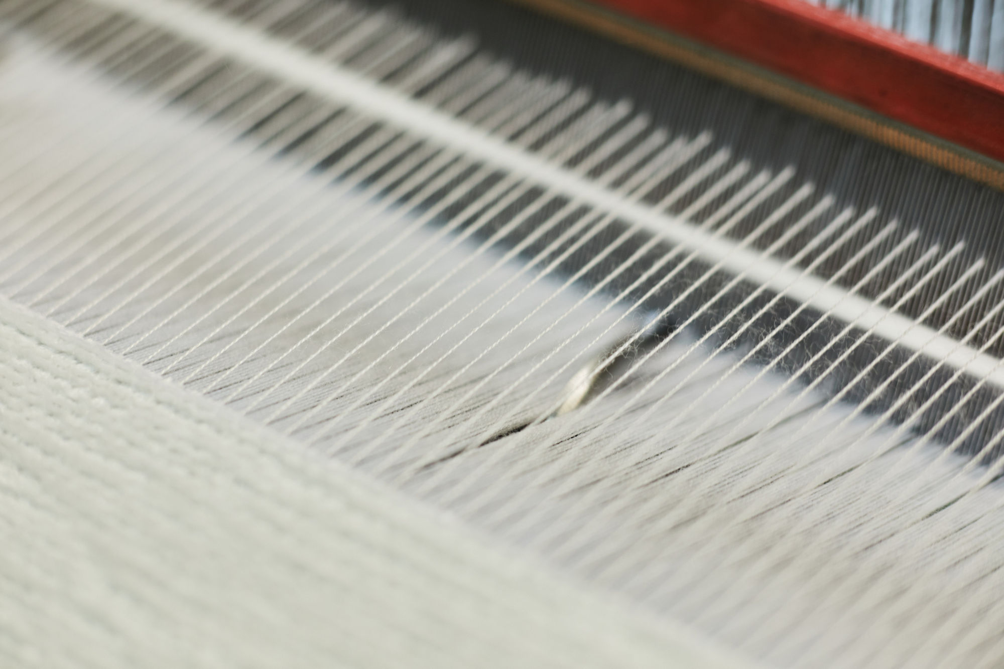 Textile factory machine weaving close up